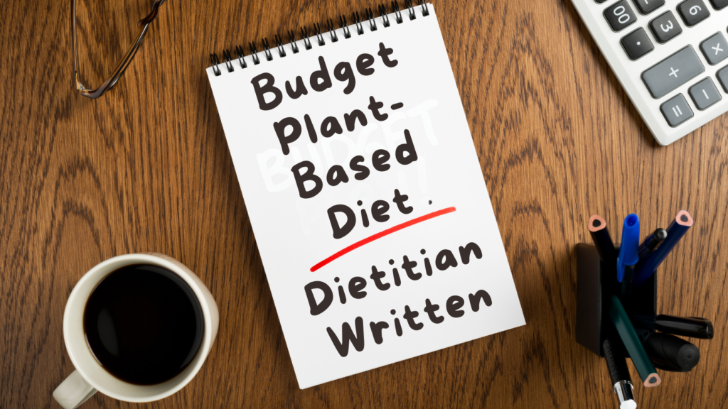 Budget Plant-Based Diet: dietitian written - written on a notepad on a table with a calculator and pens