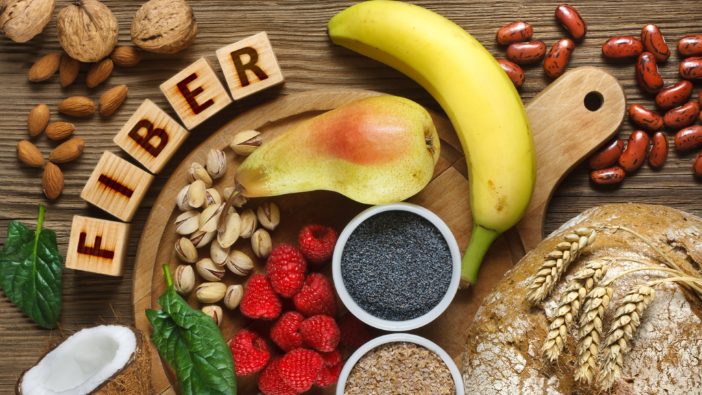 Fiber- on a table with fruits, vegetables, grains, and seeds